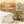 Load image into Gallery viewer, Folded organic fabric with cotton and certification logo in the background